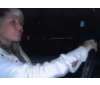 In her car...